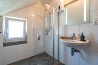 bathroom with shower and daylight